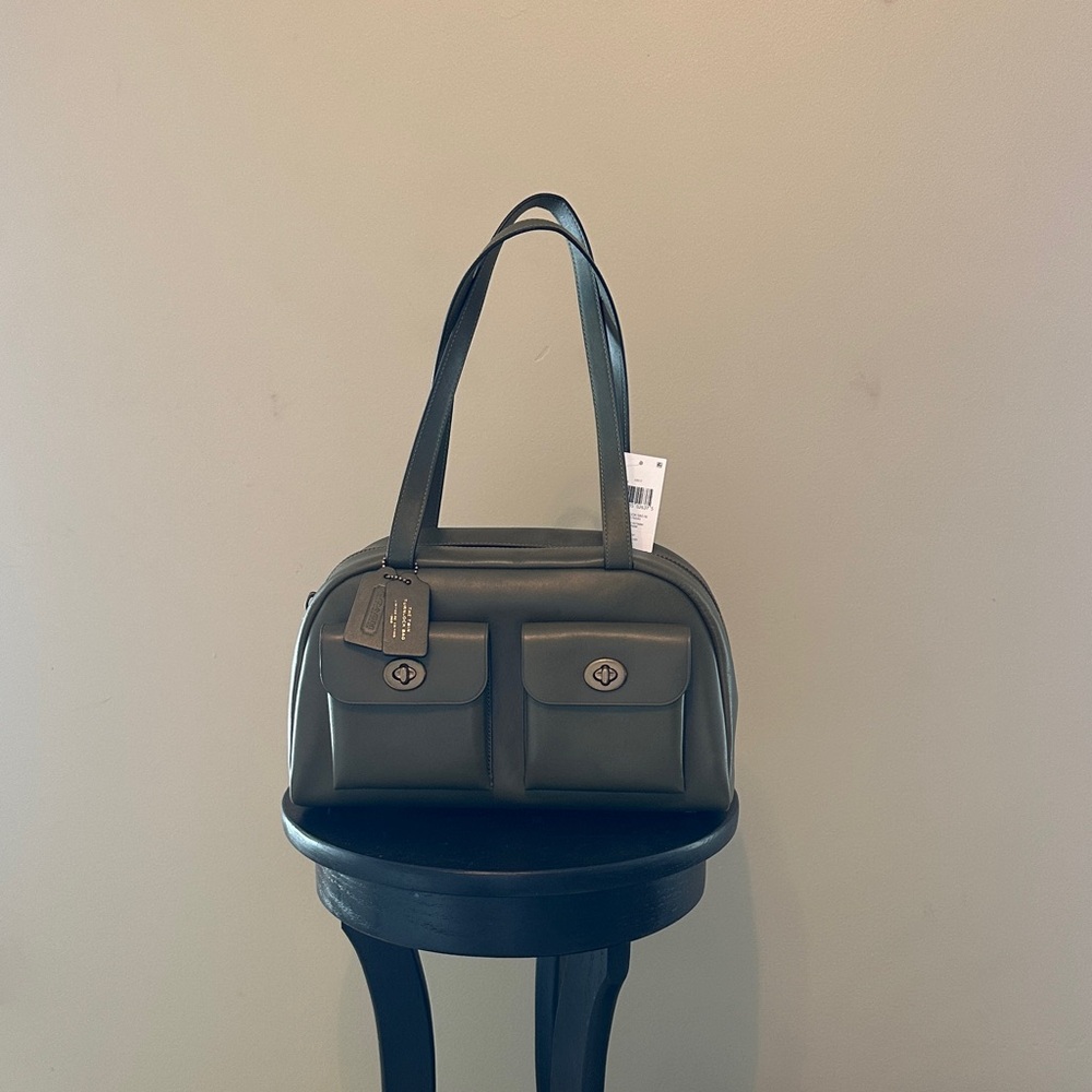 Elegant authentic Coach Olive Twin Turnlock Leather Handbag. Never worn.NWT